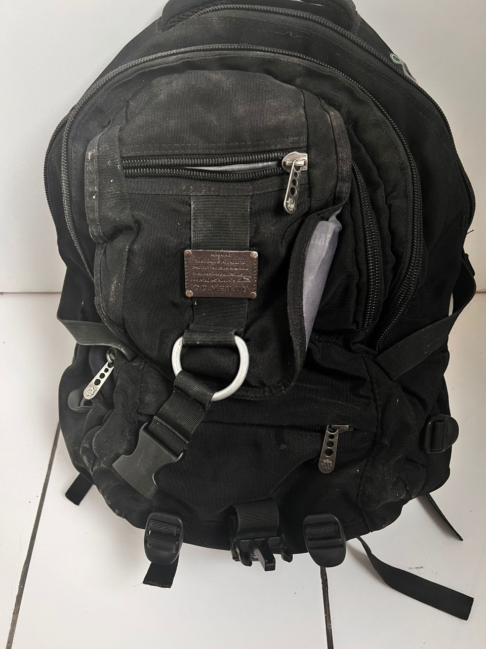 Black backpack on floor museum of calais